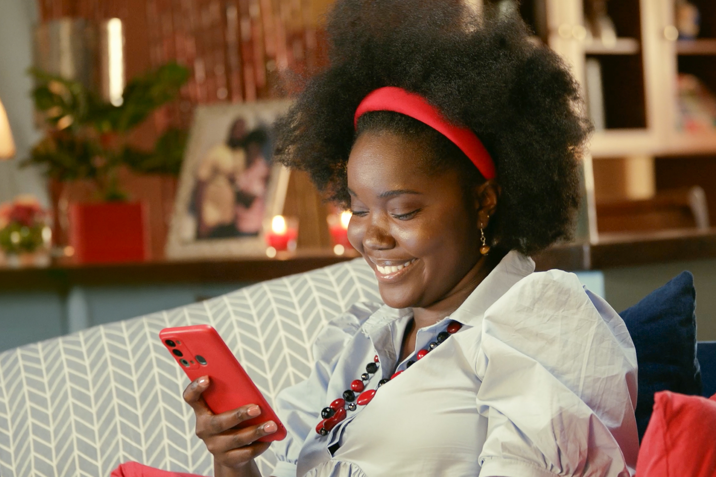 Women paying utility bill using her mobile phone
