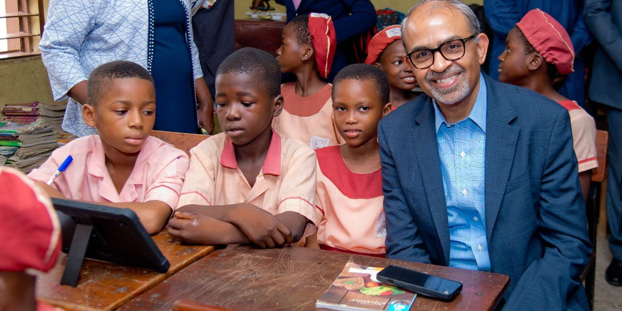 Airtel Africa CEO, Sunil Taldar, meeting children benefiting from new internet connection at their school