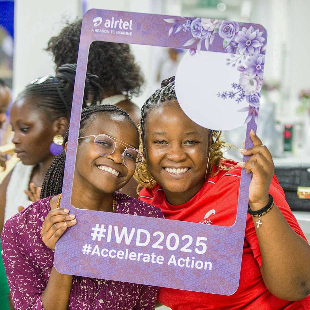 Two women celebrating our global theme of 'accelerate action' on International Women's Day