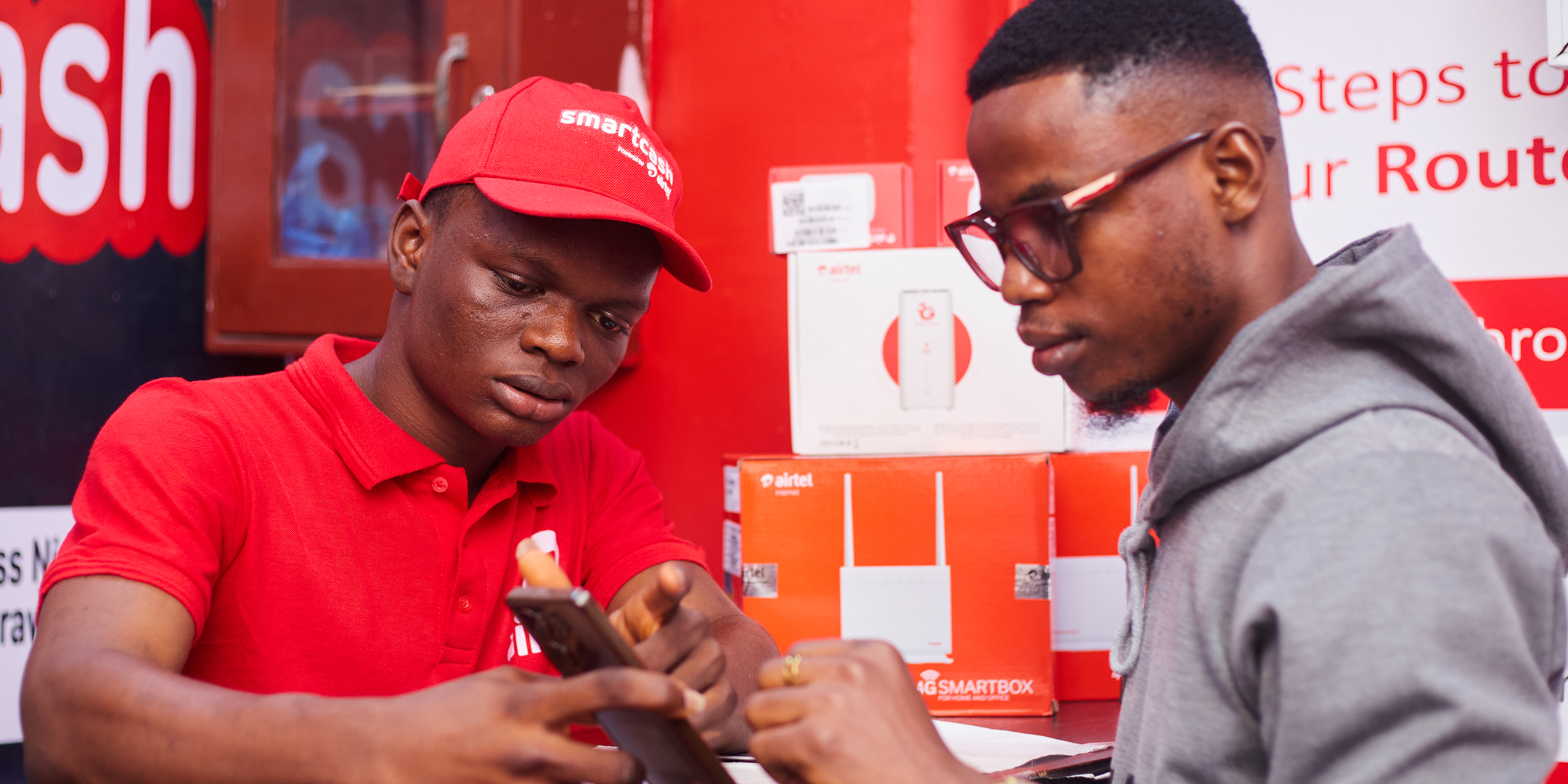 Airtel agent, Gbolahan Salaudeen, helping a customer