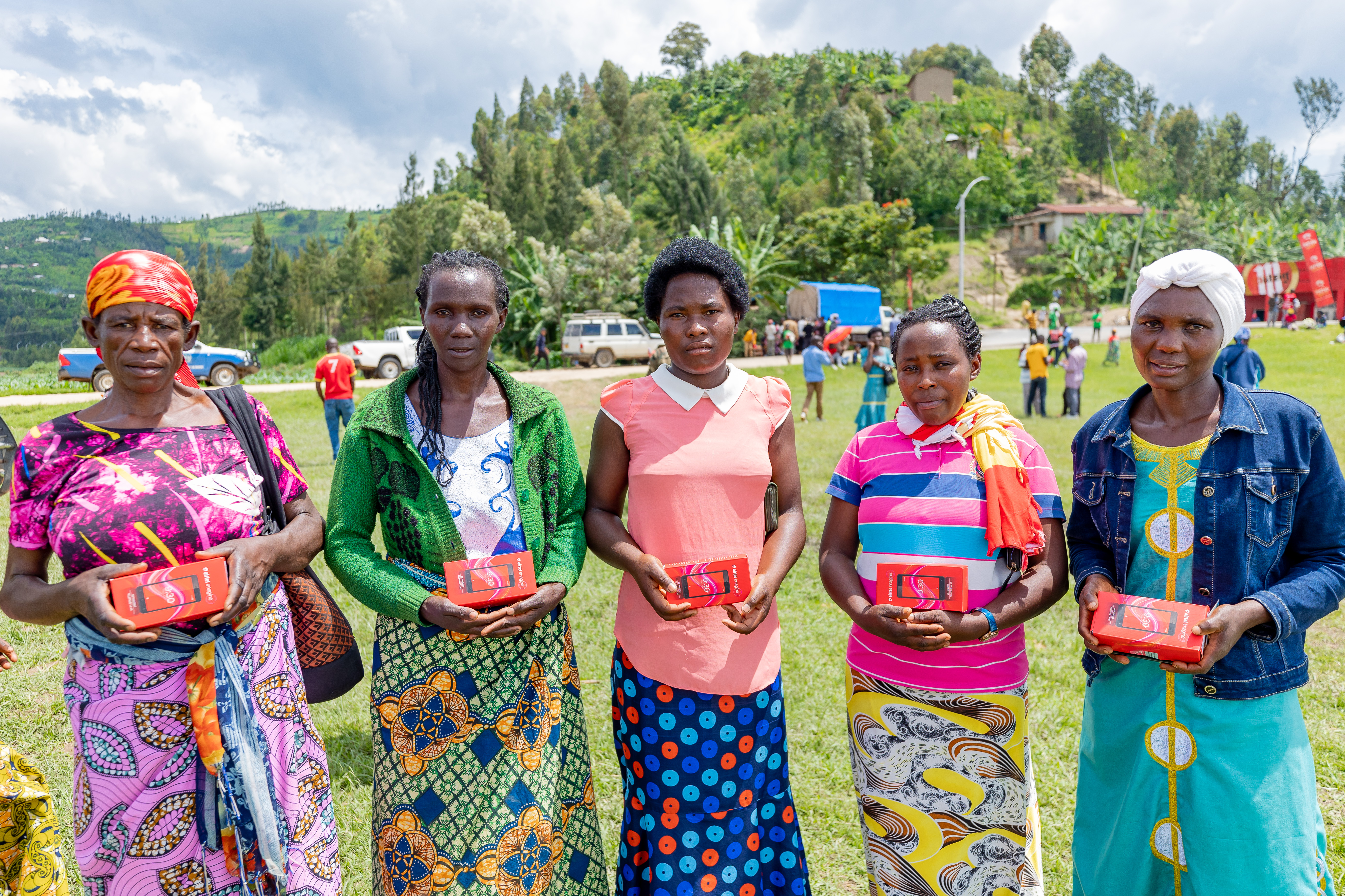 Women holding smartphones provided as part of the ConnectRwanda 2.0 initiative