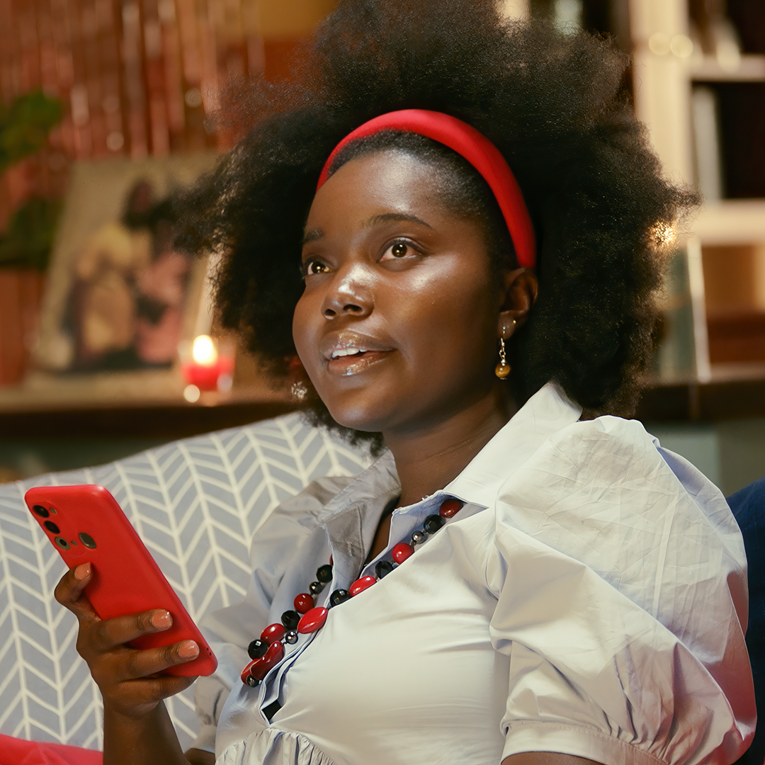 Women paying for utility bill using her mobile phone