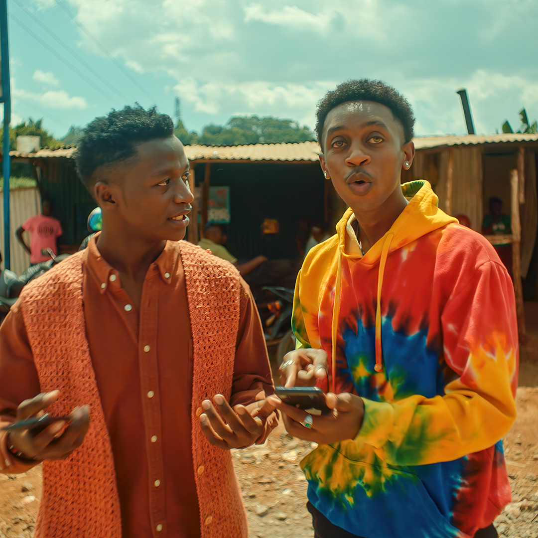 Young men using Airtel Africa services