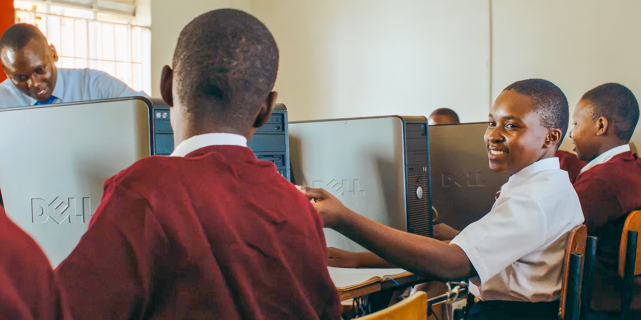 School children using computers connected to the internet with Airtel Africa products