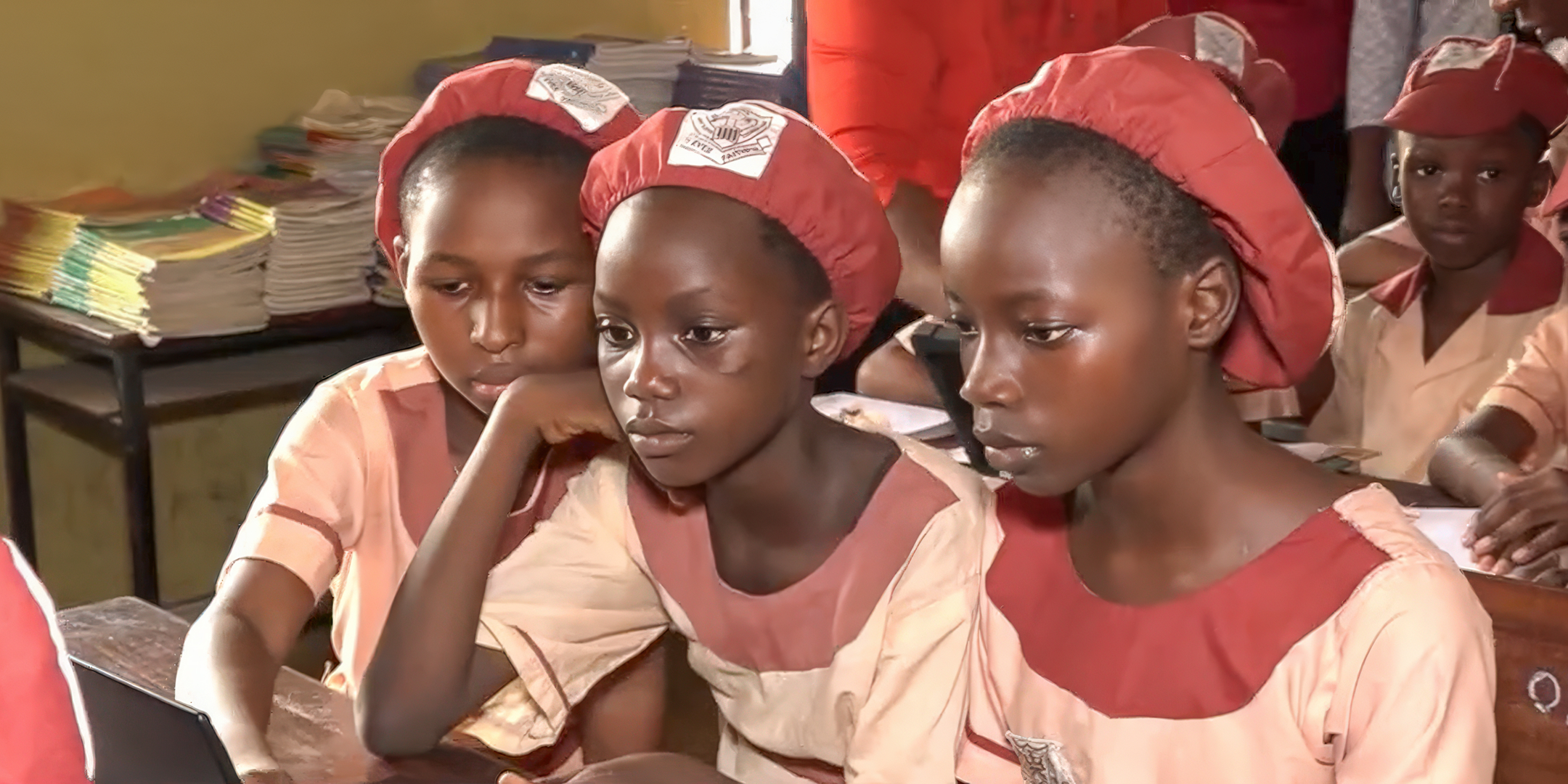 Young girls using digital devices at St. Agnes Primary School, Maryland, Lagos
