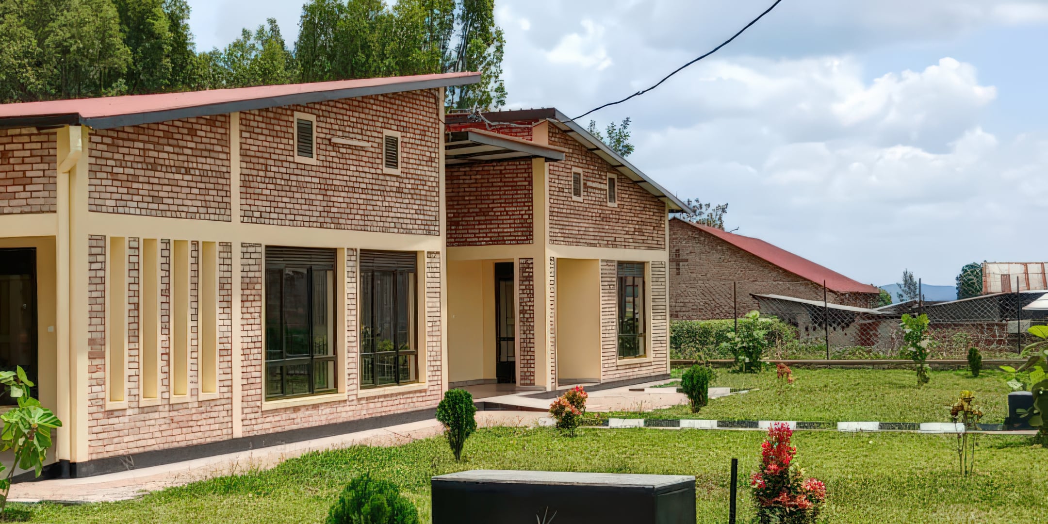 Picture of what looks to be a new building with a well-manicured lawn