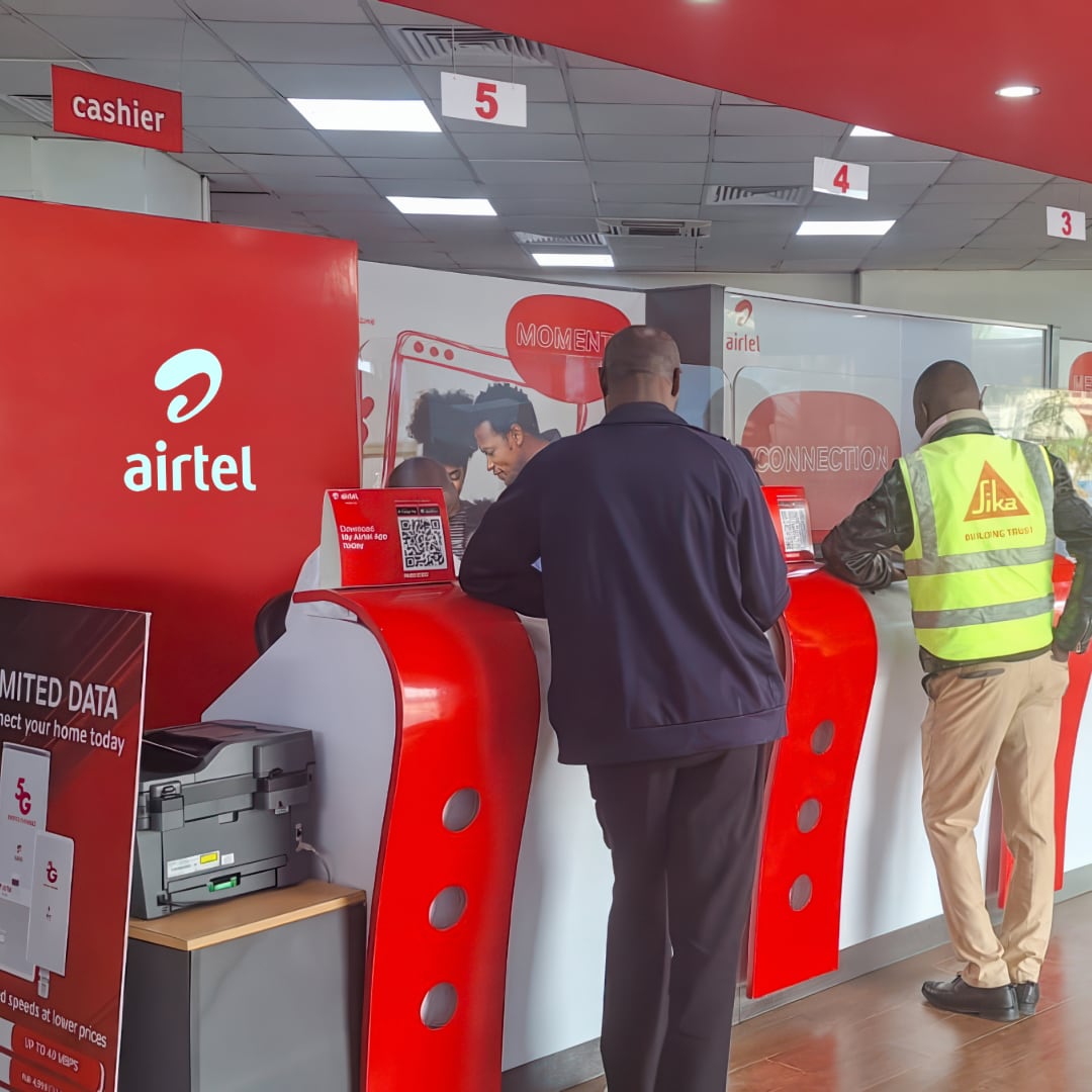 Customers being served  at the counters of an Airtel store
